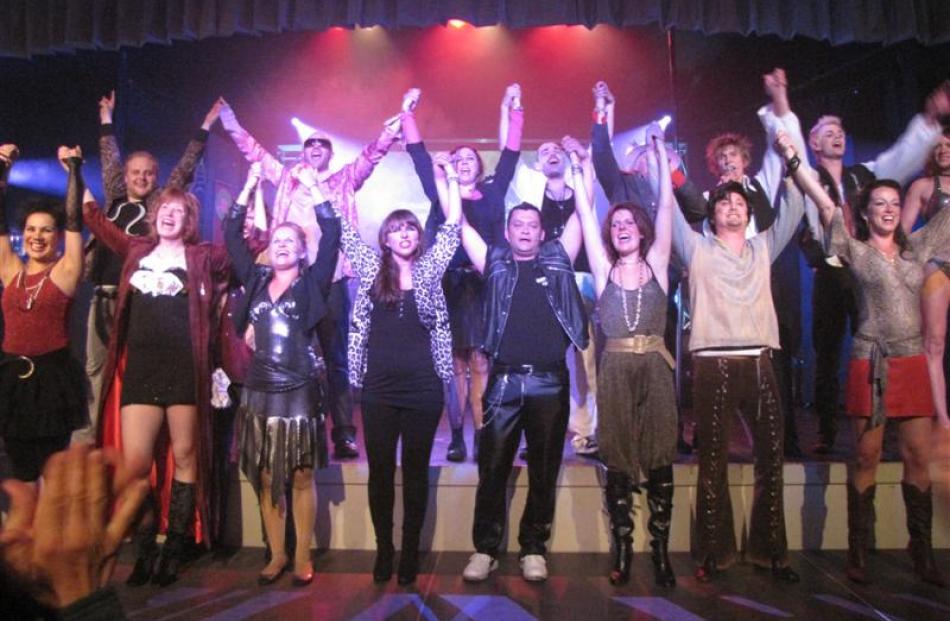 The cast of Rock and Roll Suicide takes a bow after the opening night performance at the...