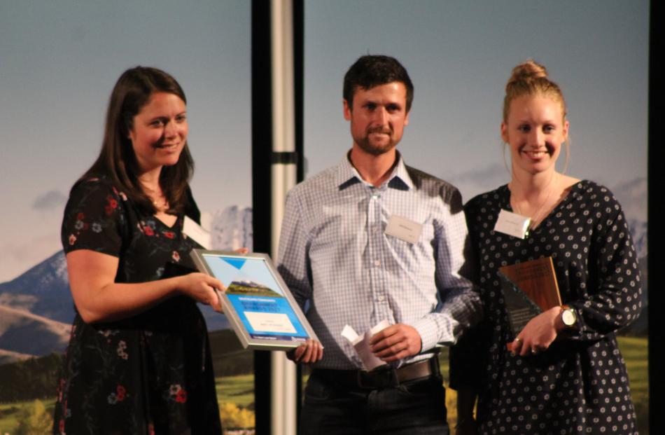Lucy de Latour, of Wynn Williams, presents Matt McKenzie and wife Sarah with the Environmental Leadership in Farming and Land Management Award for their commitment to taking environmental impact into consideration when making decisions on farm.