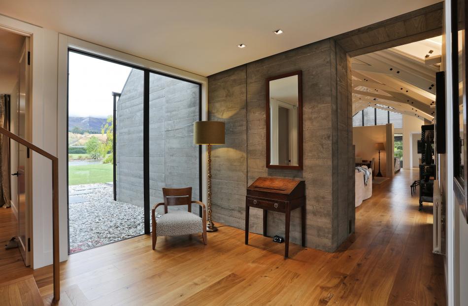 Board-finish concrete adds texture to the home’s interior.