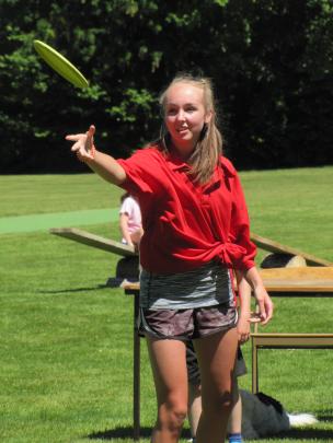 Gimmerburn team member Anna Clarke (15) throws a Frisbee.