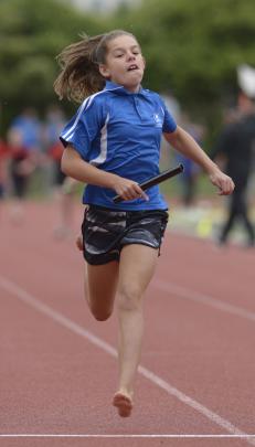 Holly Rowcroft (10) leads the field down the home straight for Kaikorai Primary School in the...