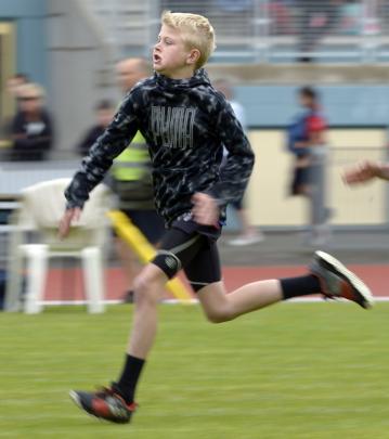 Liam Brady (11), of Outram School, competes in the boys' under-12 75m sprint. 