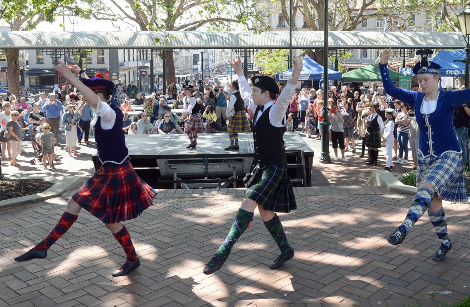 Dancing the Seann Triubhas in front of a large crowd  are (from left) Morgane Torr (15), Oe...