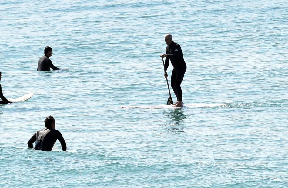 The shark sighting was not enough to stop a group of surfers and paddleboarders from hitting the waves at St Clair yesterday.