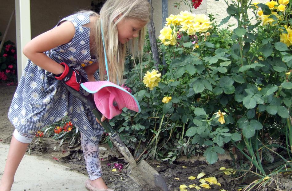 Roxburgh Area School pupil Alexina Ballantine (8) was the youngest to get dirty and help clean out one Tweed St property.