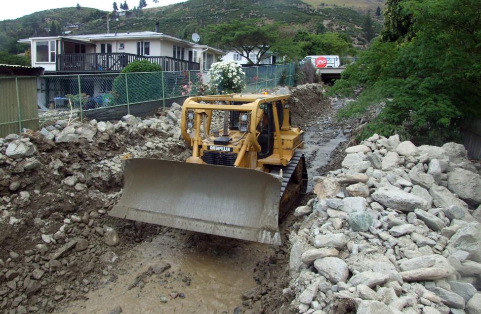 Bulldozers and excavators were being used by contractors in Reservoir Creek in the north end of Roxburgh yesterday afternoon to clear rocks from the area.