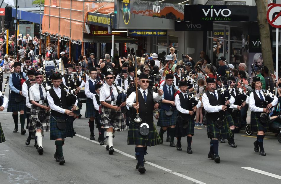 The City of Dunedin Pipe Band leads the parade. 