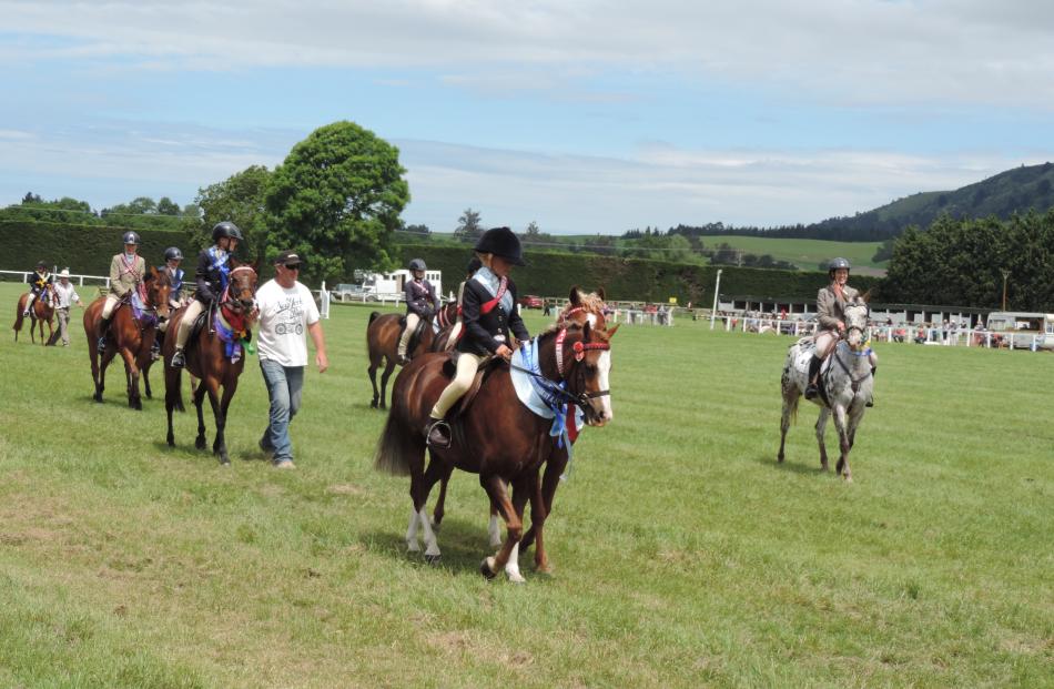 Young equestrians show off their skills - and ribbons - in the Grand Parade.