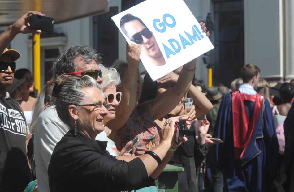 Family and friends support Adam Jones during the graduation parade  in George St yesterday....