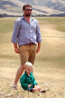 Gimmerburn farmer Simon Paterson and younger son Bede (3) during a field day at their property. 