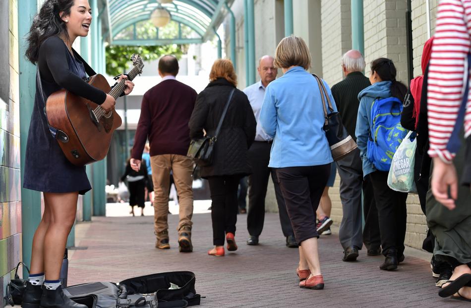 Deina Susilo-Knox, of Dunedin, serenades passers-by in Albion Lane.