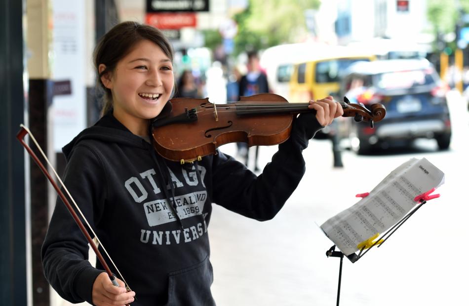 Serenity Hook, of Dunedin, entertains pedestrians in George St yesterday. Photos: Peter McIntosh