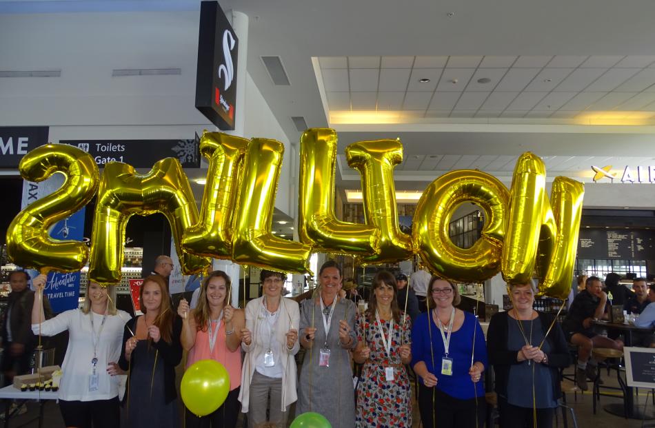 Queenstown Airport staff wait to greet the two millionth passenger this year, on a flight from...