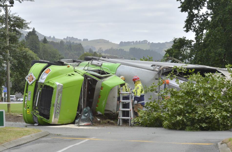 A truck on its side at the intersection of Pine Hill Rd and Great King St. Photo: Gerard O'Brien