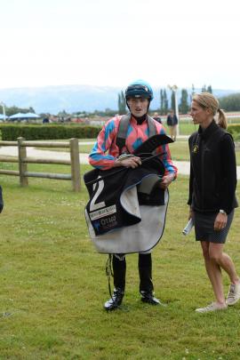Mosgiel jockey Jacob Lowry and trainer Claire Anderton share some down time after a race at the Interislander Summer Festival at Wingatui Racecourse yesterday. Photos: Linda Robertson