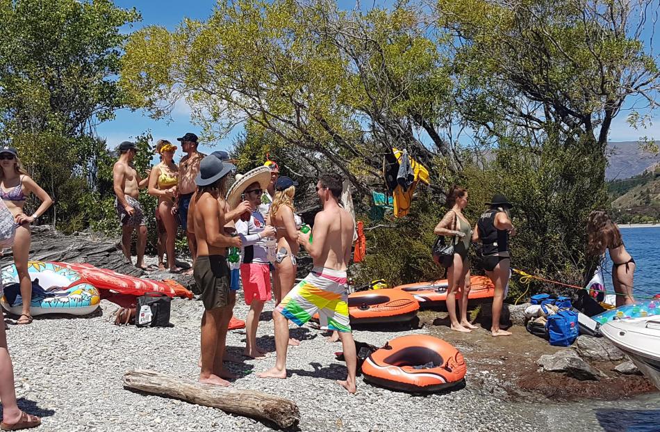 QLDC harbourmaster Marty Black and other water safety staff were monitoring the influx of visitors to Ruby Island yesterday. Photos: Mike Houlahan