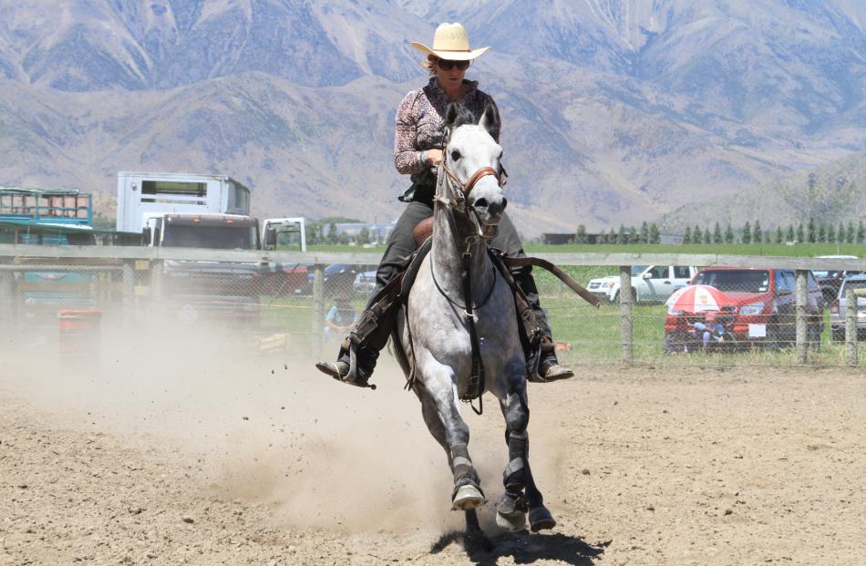 Angie Meehan, of Wanaka, competes in the open barrel race.