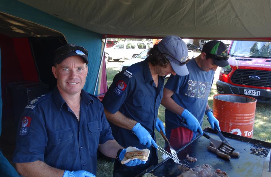 Lake Hawea Volunteer Fire Brigade members (from left) Brent Arthur, Lorne Capell, and Hunter...