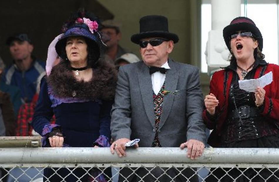From left, Sandy Jones-Scott, Bruce Hart and Gaye McBride, of Oamaru, engrossed in the outcome of...