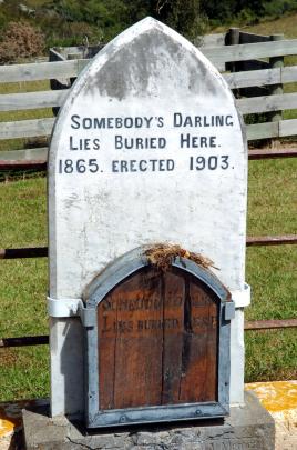William Rigney's original pine plaque for "Somebody's Darling'' sits in front of the later marble headstone at Horseshoe Bend. Photo: Gerard O'Brien 