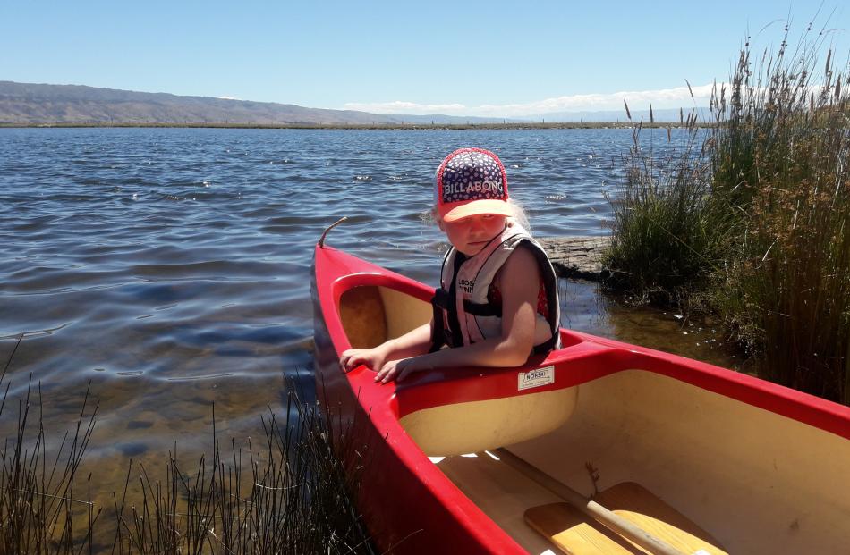 Lucy Bryant (7) waits to take a ride in a canoe near Patearoa, in Central Otago, on December 28. Photo: Craig Bryant