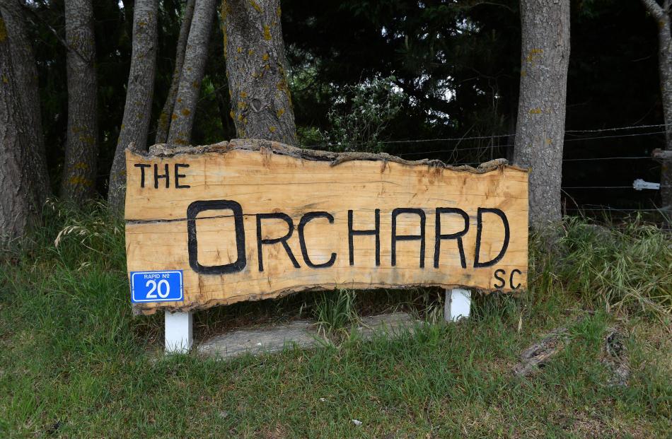 The sign at the entrance to the Orchard Sun Club. 