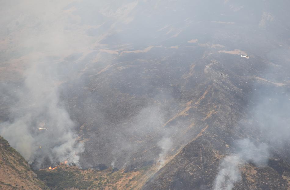 Smoke rises from the fire in Wanaka this morning about 7am. Photo: Kerrie Waterworth