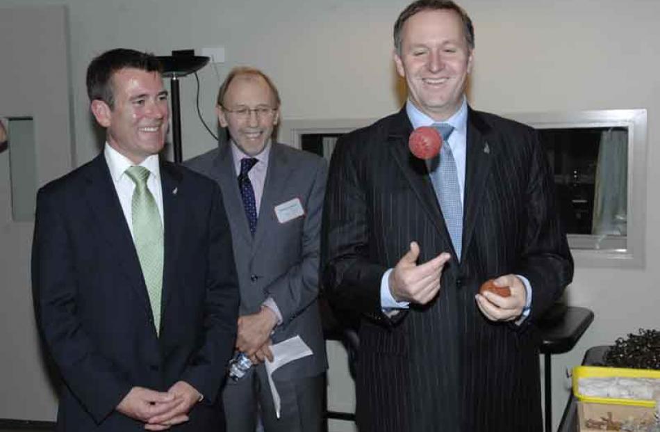 Prime Minister John Key demonstrates his juggling skills with a squelchy ball watched by (from...