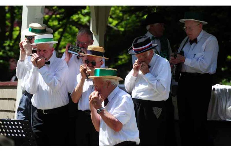 Musical notes. . . members of the Oamaru Savage Club entertain the crowd at the Victorian garden...