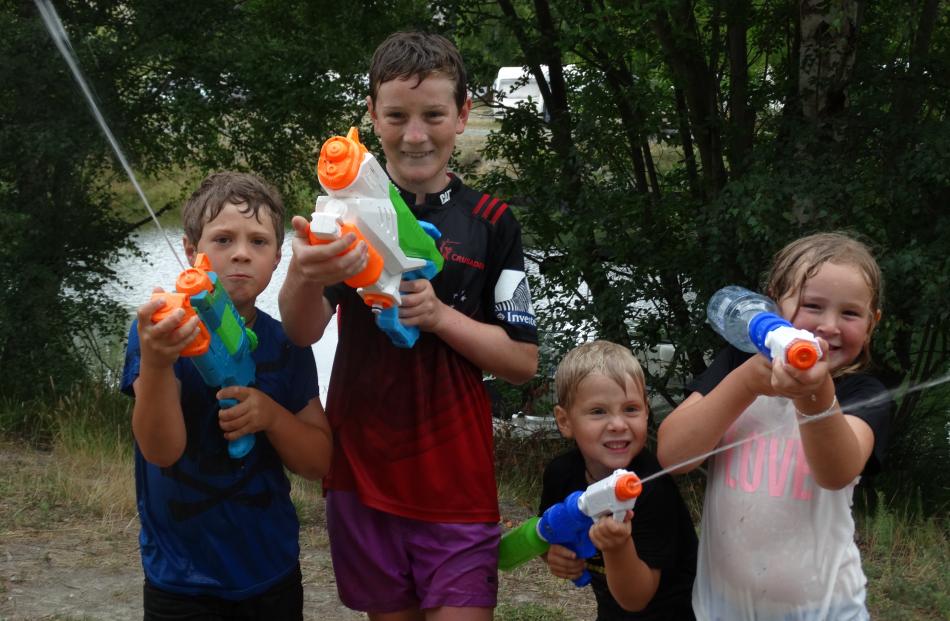 Alex Dally (7, left), Jacob Knoef (12), Harry Dally (5) and Jessica Stewart, all of Christchurch,...