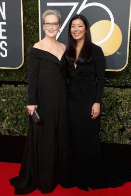 Meryl Streep (left) wearing Vera Wang with activist Ai-jen Poo. Photo: Getty Images 