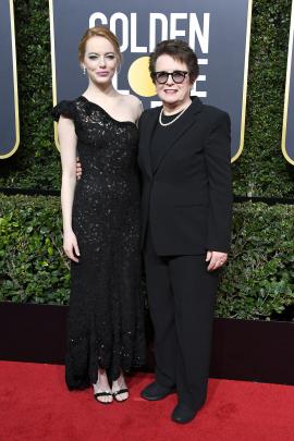Emma Stone (left) in Louis Vuitton with tennis great Billie Jean King. Photo: Getty Images 