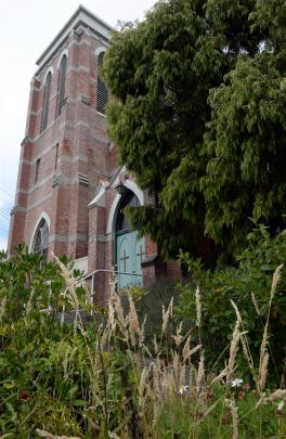 The Andersons Bay Presbyterian Church, now overgrown and showing signs of disrepair, is expected to be put on the market soon.