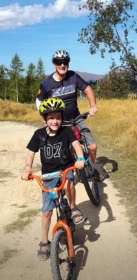 Murray McDowell and his grandson, Xavier Bristow (7), ride in the Naseby Forest. Photo: Sue McDowell