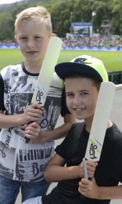 Charlie Templeton (9) and Eli Puna (9), both of Tapanui, wait to get some prized Black Caps...