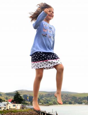 Cameron Walters (6) flies high on the trampoline at Harington Point last weekend. Photo: Martin Van Raalte