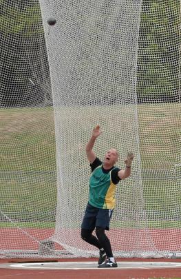 Tom Gravestock looks to see how far  his hammer throw travels.