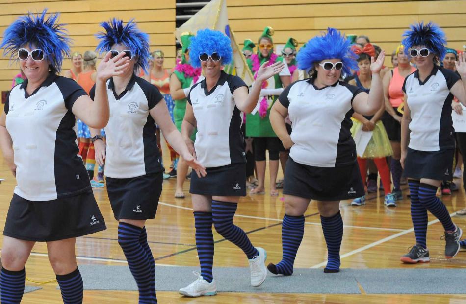 Netballers in the March Past on Saturday at the Edgar Centre.