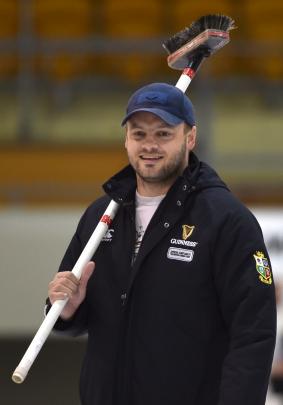 Scott Becker brandishes his broom.