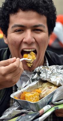 Digging into hangi food is Otago University student Leonardo Nava, of Mexico, during Waitangi Day celebrations in the Octagon. The hangi was prepared by members of Arai Te Uru marae. Photos: Peter McIntosh