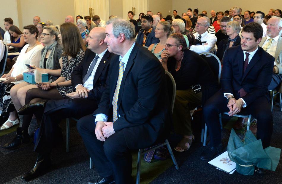 New citizens and their supporters attend the ceremony in the Municipal Chambers yesterday.