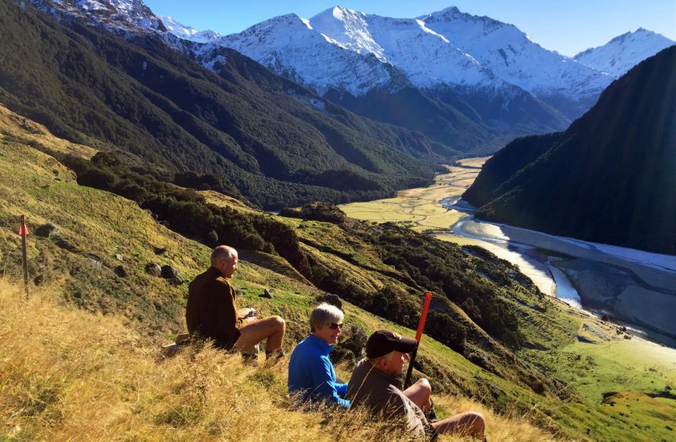 Above the Shotover River are (from left) Derek and Gillian Crombie and Paul Hellebrekers.