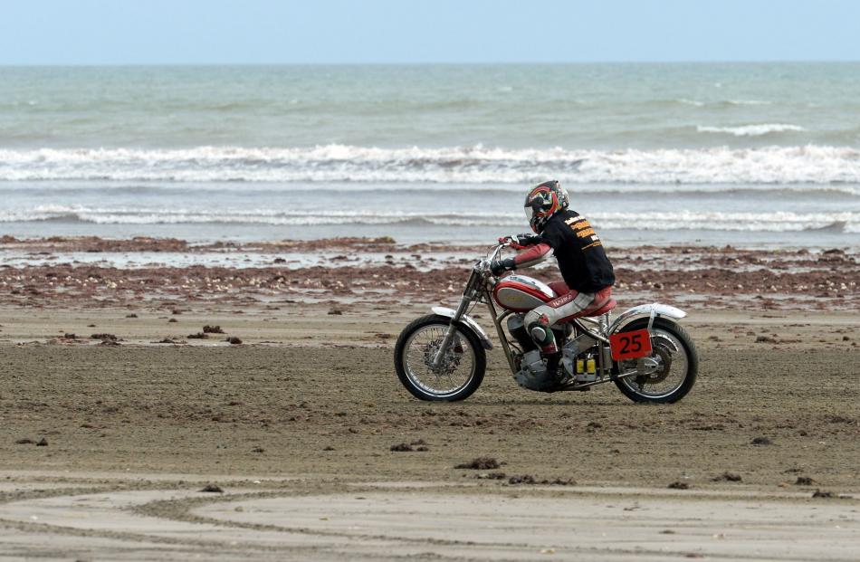 Paddy Snowden, of Christchurch, powers up the straight on his 1942 Indian Chief 1200.
