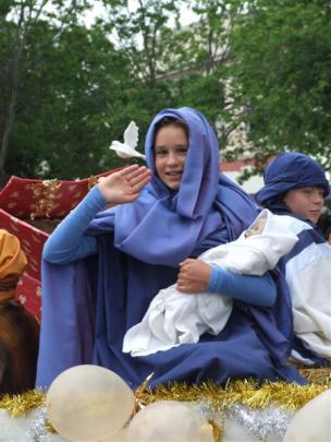 Gabrielle Hay (13), dressed as Mary, as part of a nativity scene on one of the floats in the...