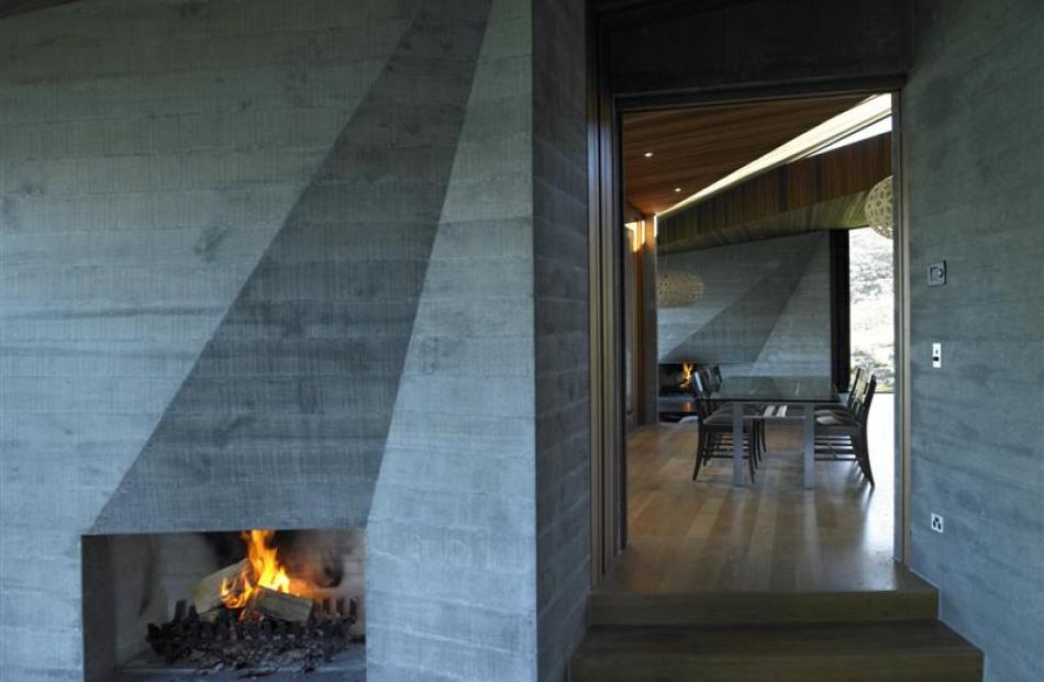 Twin sculptural fires anchor the main living space.