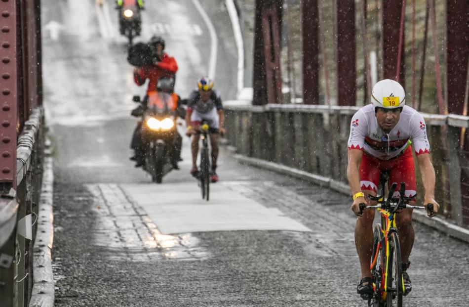 Half Challenge winner Javier Gomez, of Spain, presses on during the 90km bike leg.
