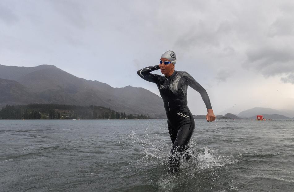 First woman home Amelia Watkinson exits the water.