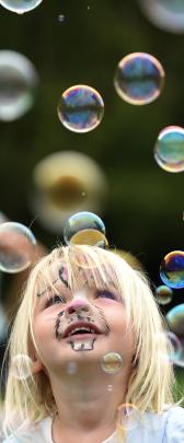 Rosie Verhoef (2), of Dunedin, enjoys some bubbles.