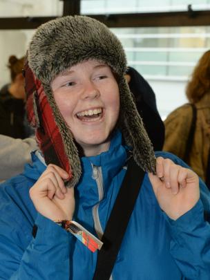 Piper Hathaway (17), of Lake Tekapo, tries on a fluffy hat to prepare for the impending cold.