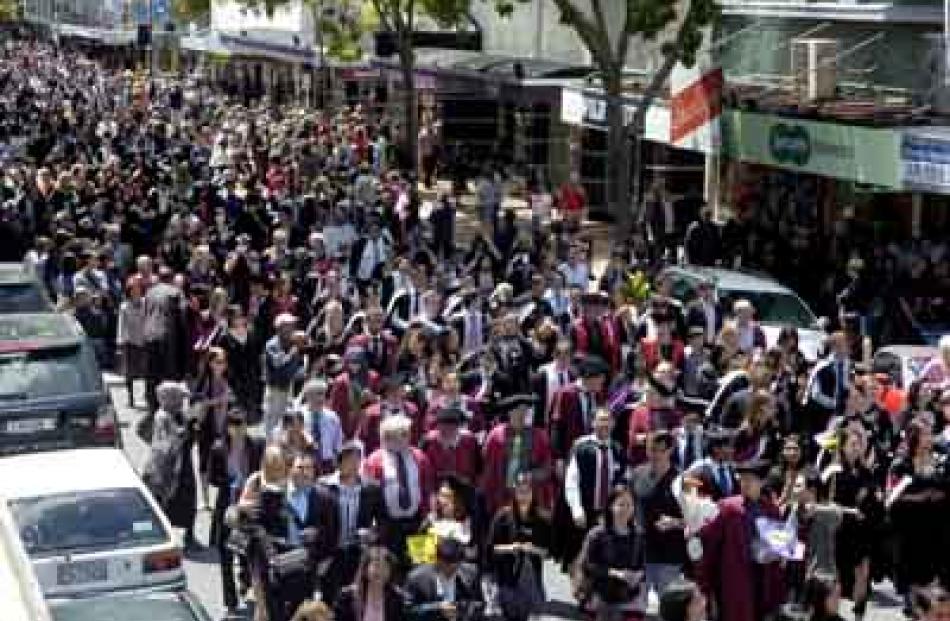 The graduands make their traditional parade down George St before the ceremony.